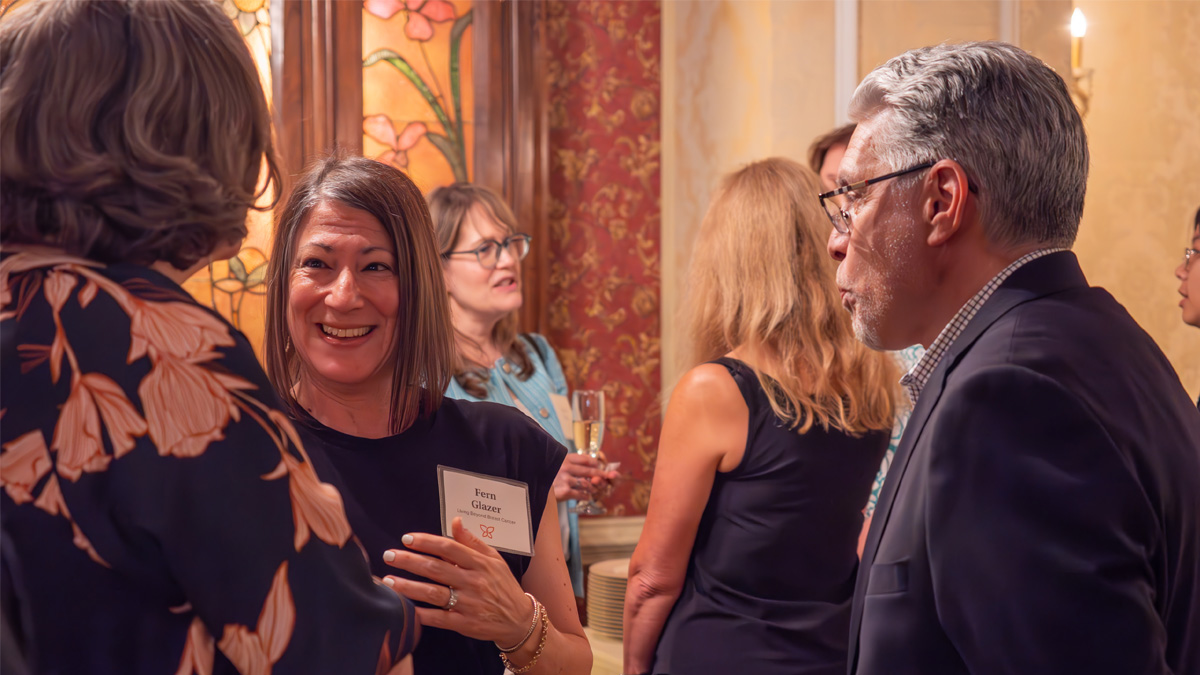 Fern Glazer talking to people at the 2025 Butterfly Ball Preview Party