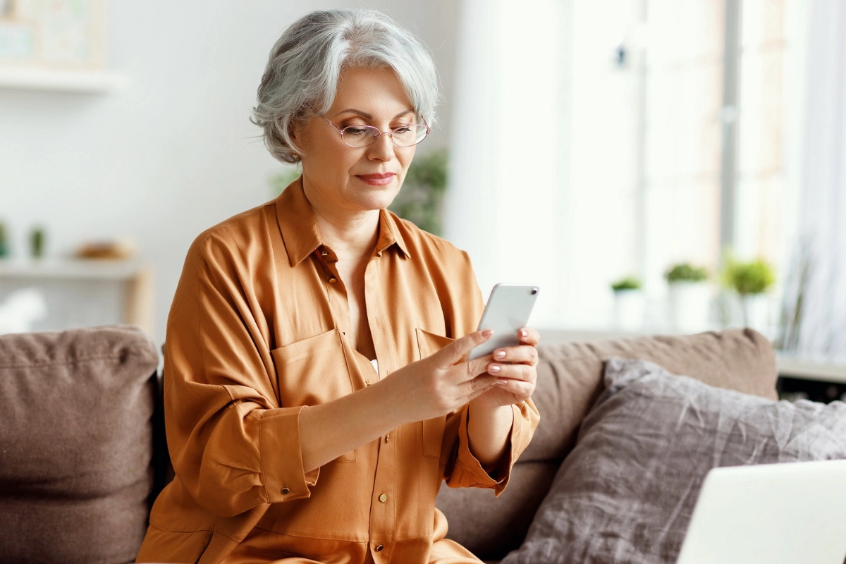 Mature woman accepting call on cell phone
