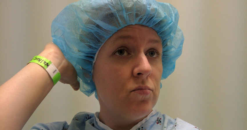 Rachel Walker posing in a surgical cap and gown