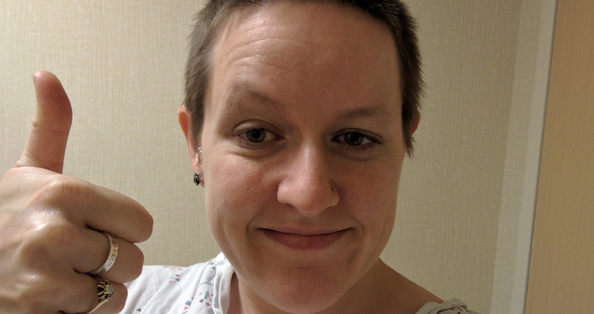 Rachel Walker selfie, giving thumbs up post-surgery
