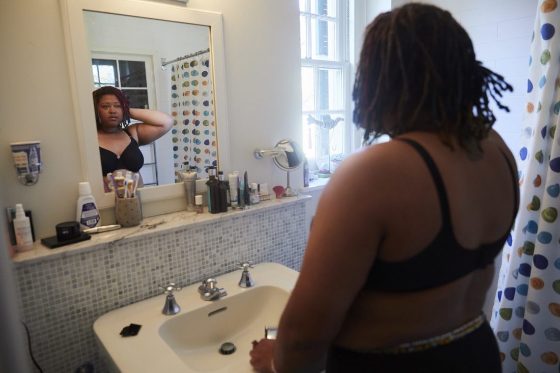 Woman looking in mirror