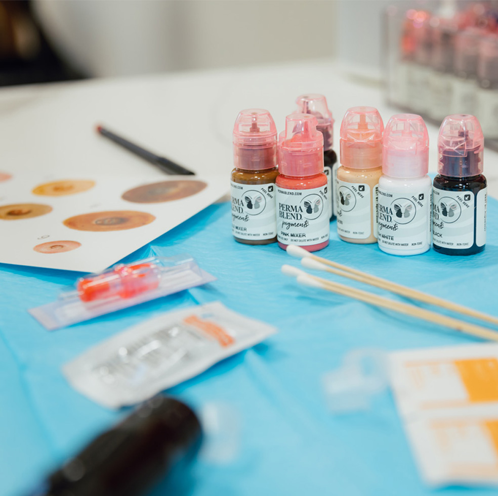 Display of tattoo inks and supplies to create 3D nipple tattoos.