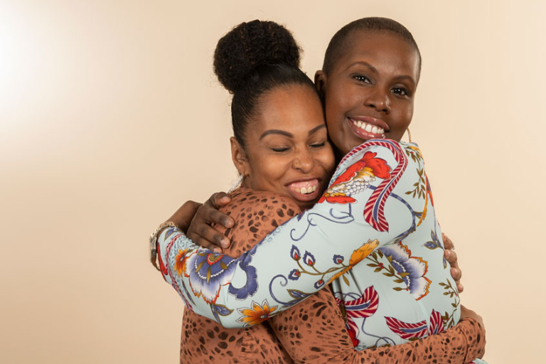 Black mom and daughter hugging