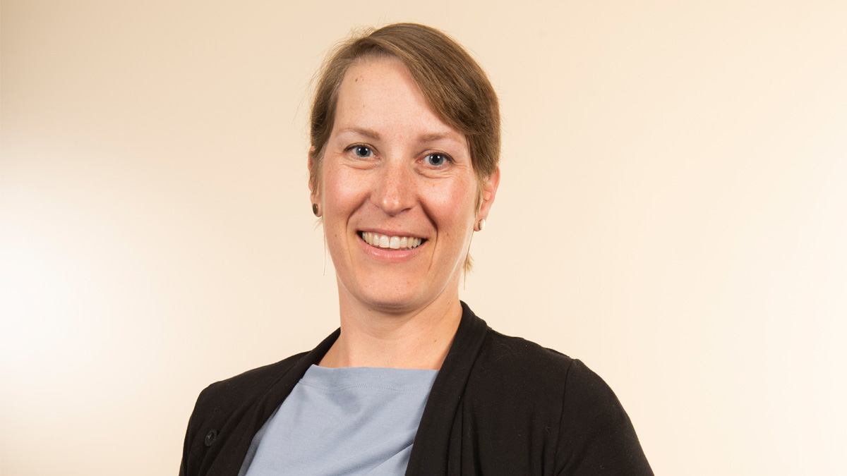 A white woman smiling