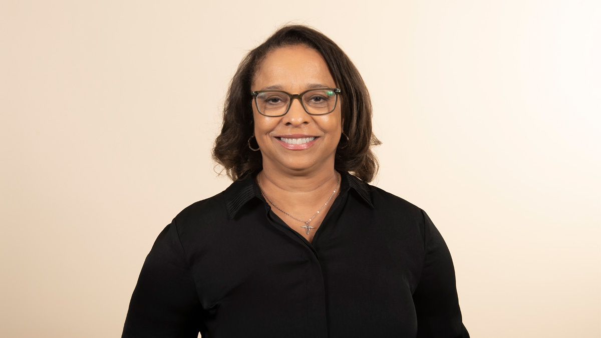 A Black woman smiling.