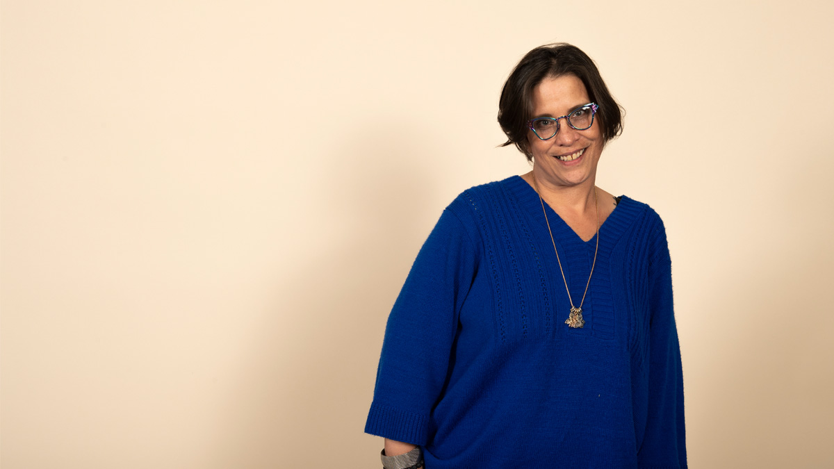 A Latina woman smiling.