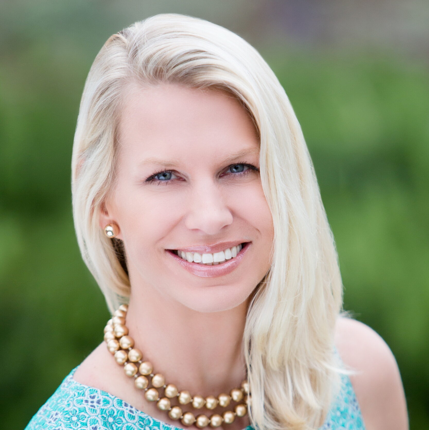 Karen Horton, a white woman with medium-length blond hair