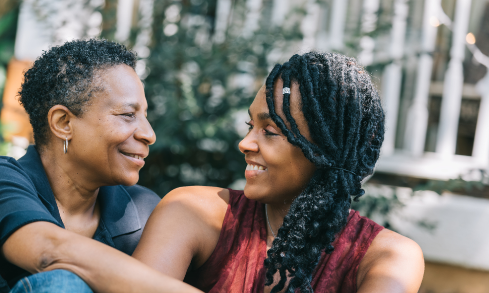 Two Black women looking lovingly at each other