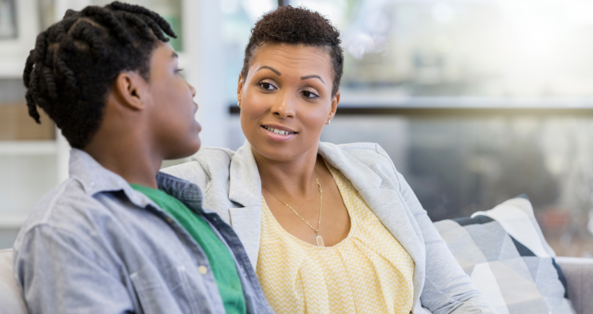 Black mom talking to teenage son