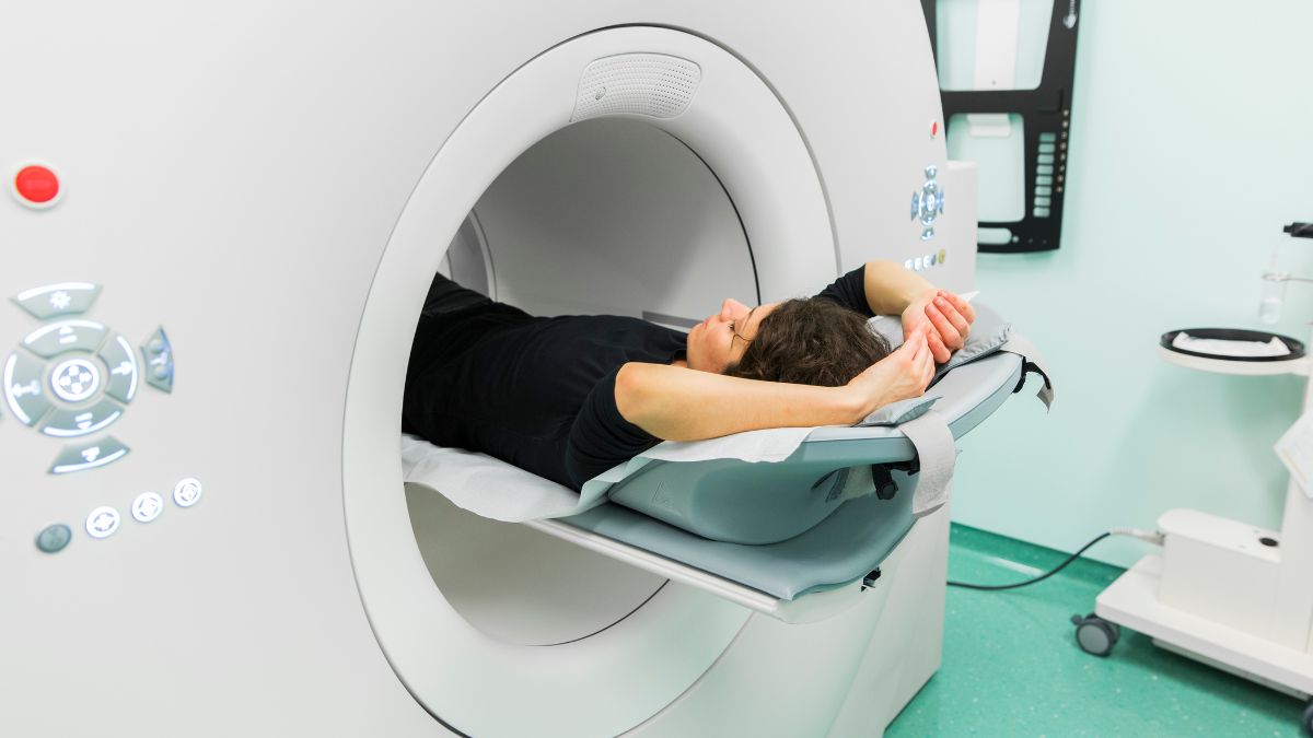 A woman inside a PET scan machine