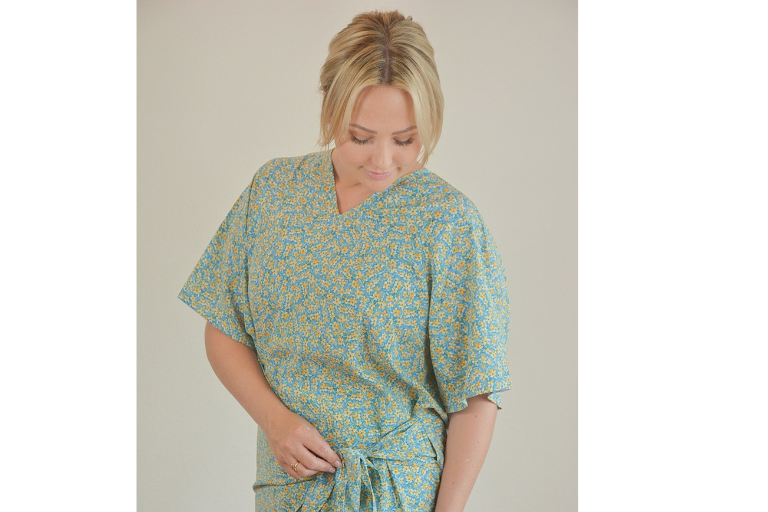 Woman wearing a patterned hospital gown