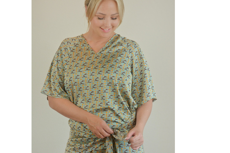 Woman wearing a patterned hospital gown