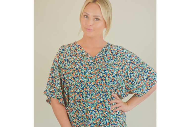 Woman wearing a patterned hospital gown