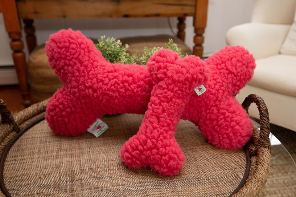 Two pink plush bones