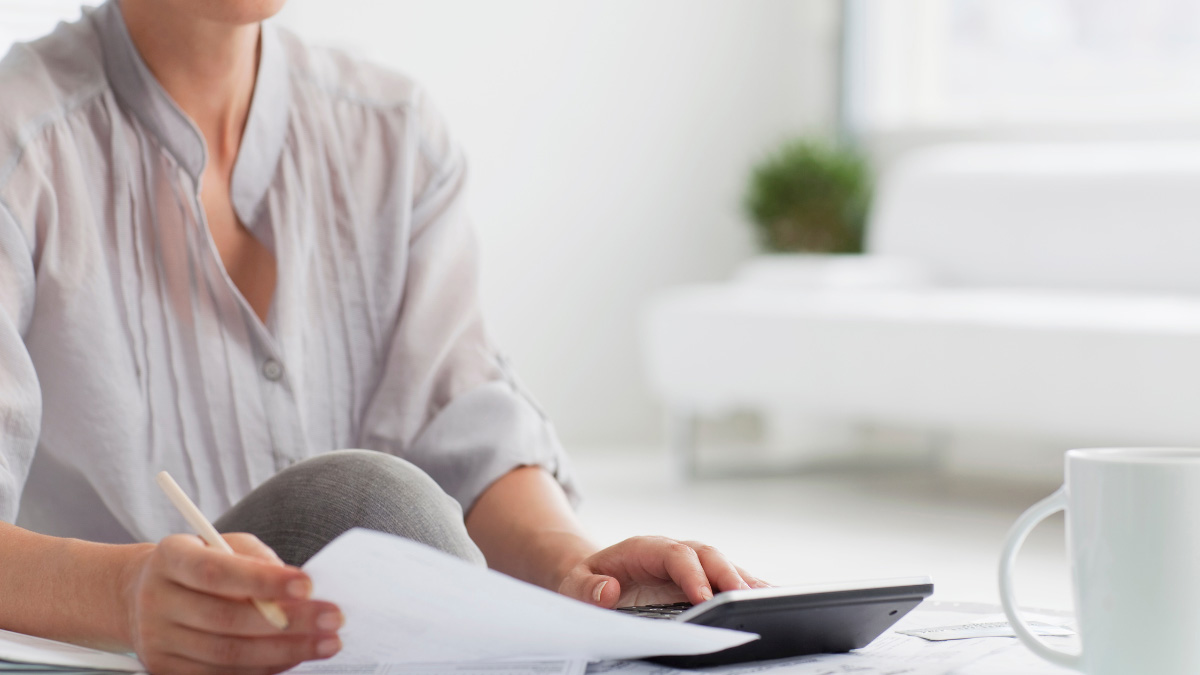 A woman looking at a piece of paper