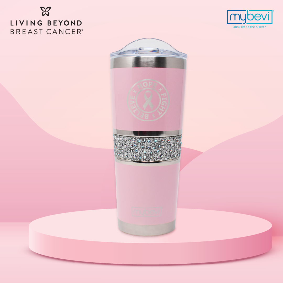 Pink tumbler with a lid and crystal insert.