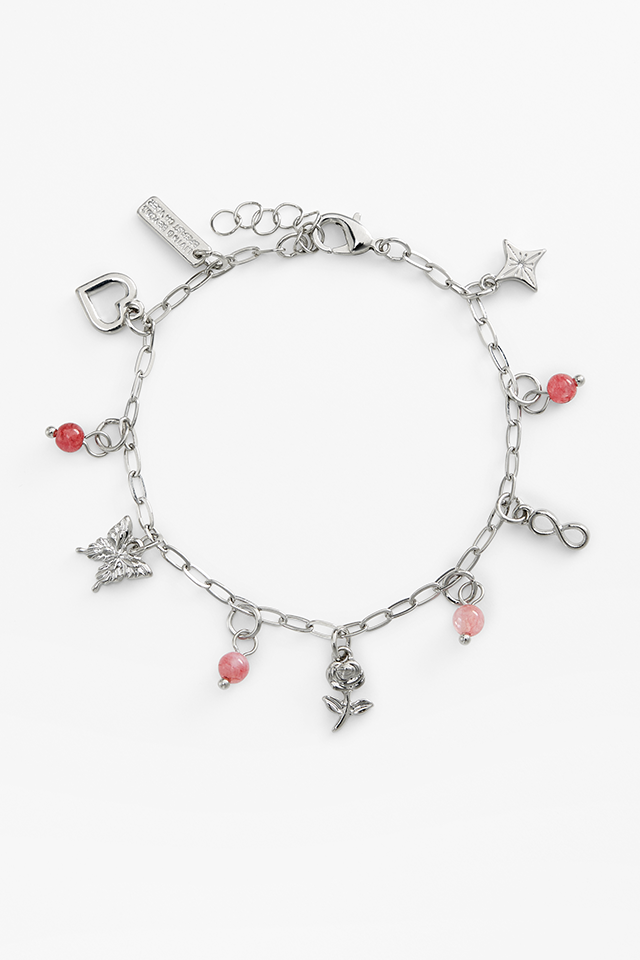 A silver bracelet with charms.