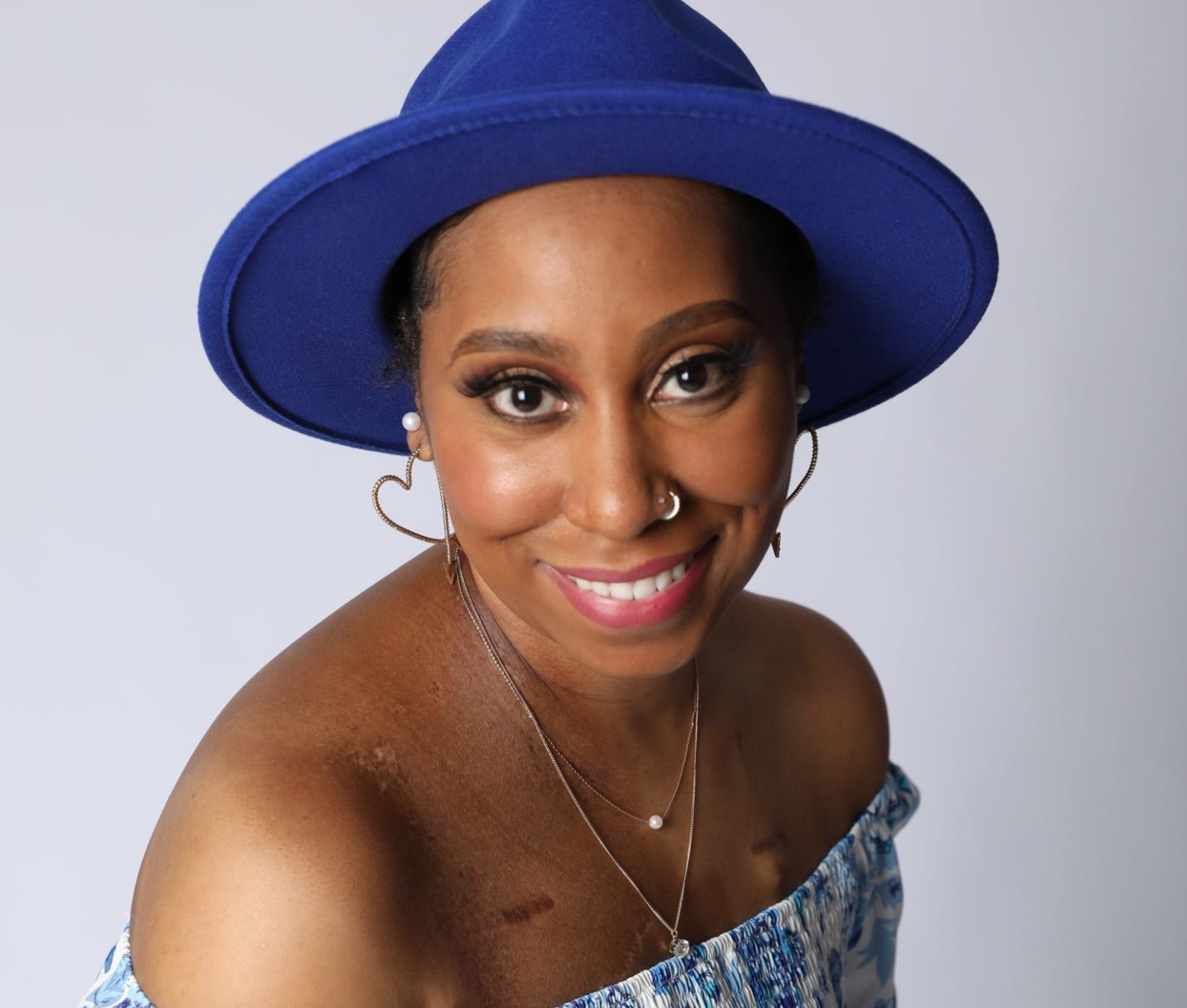 Paris wears a blue hat