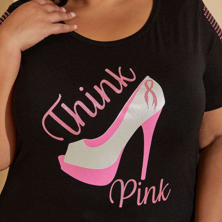 black shirt with a silver and pink high heel, saying 
