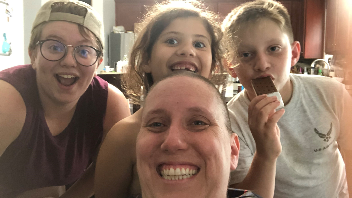 Emily with her mom and two younger siblings