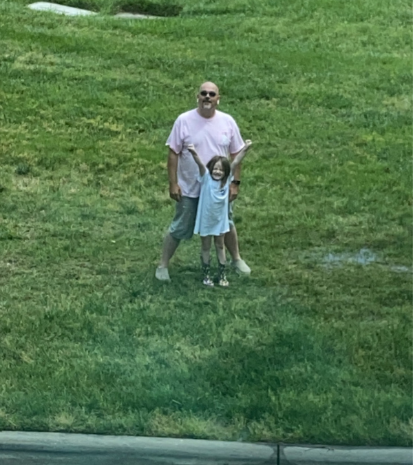 Jack and his daughter dancing outside of Rifka's hospital window