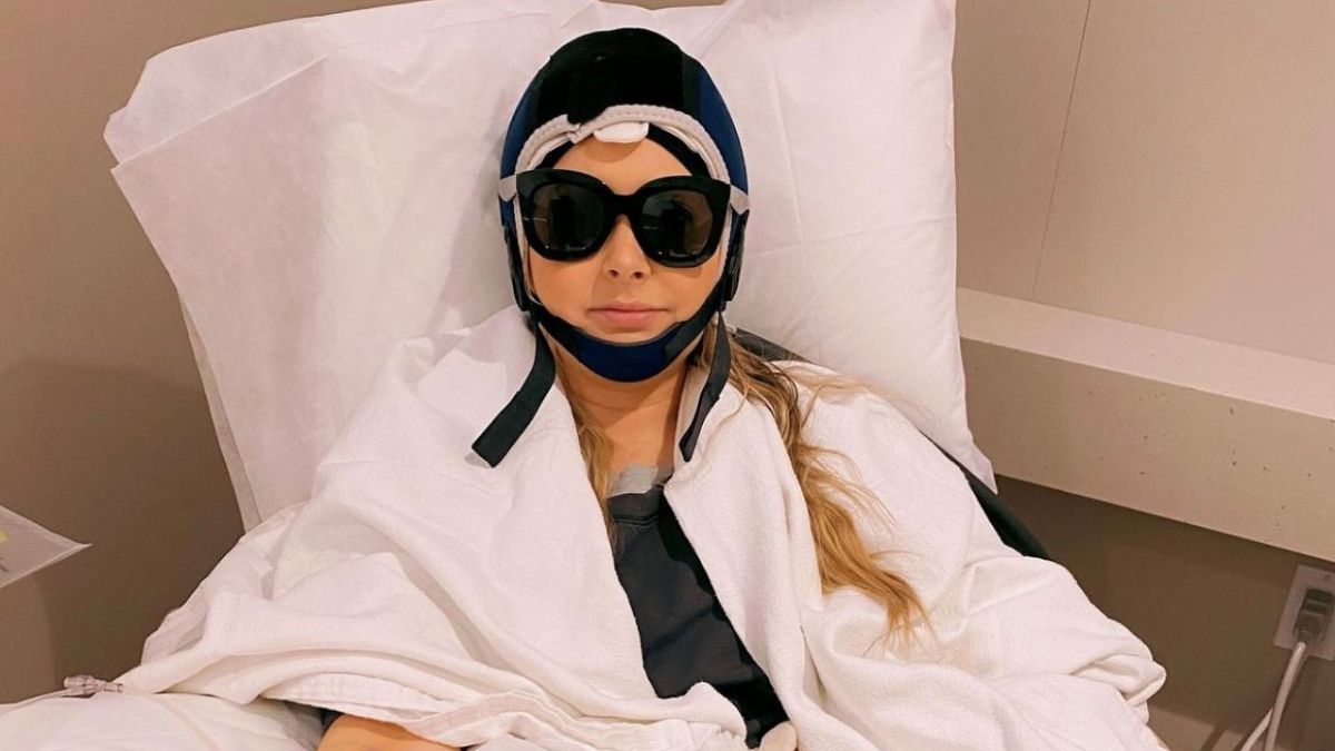 Woman in scalp cooling head gear during chemo