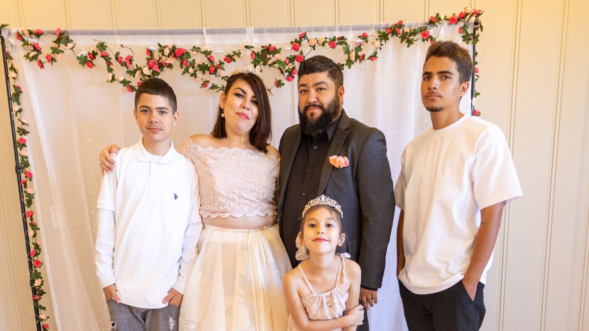 Deb and Joel with their children on wedding day