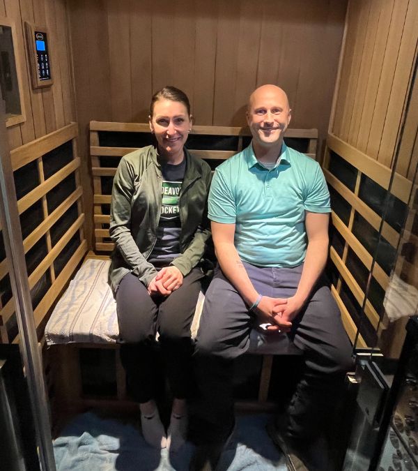 Amanda and her husband in their infrared sauna