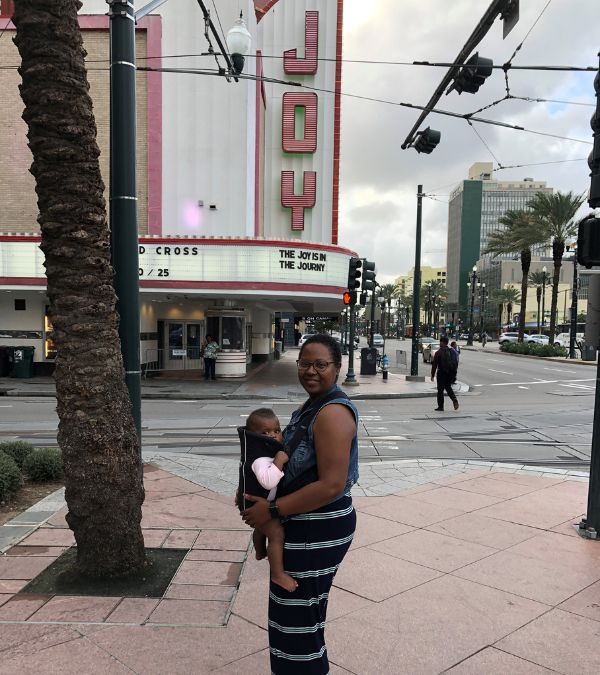 Cheryl and baby in front of Joy theater