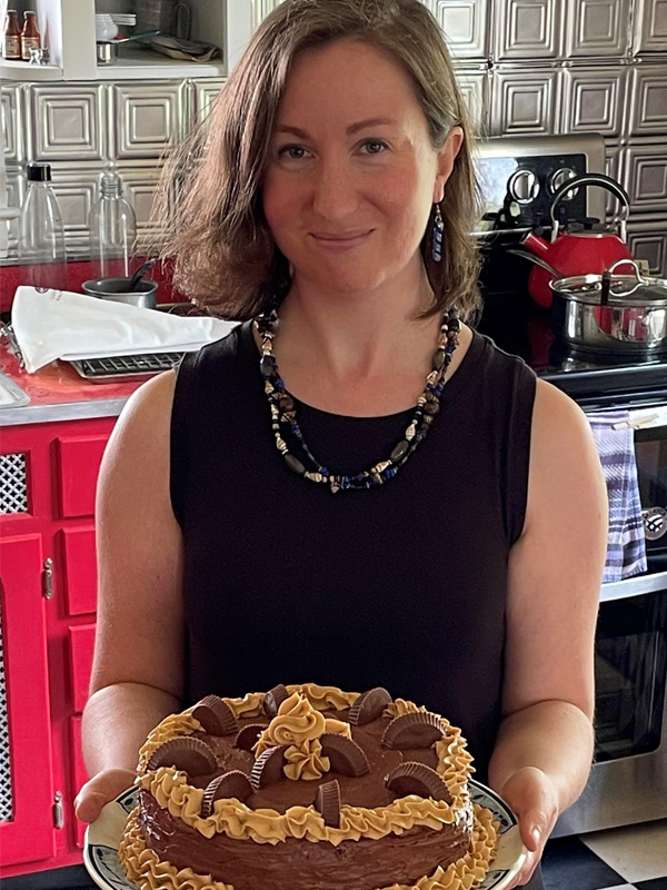 Young woman holding with cake