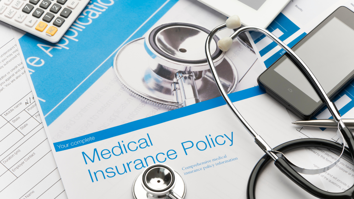 Insurance policy and stethoscope