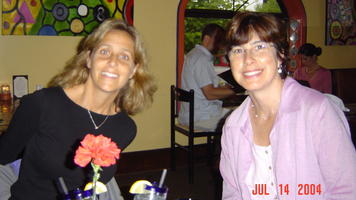 Jean Sachs and Cathy Ormerod at a restaurant. A timestamp on the photo says Jul 14 2004