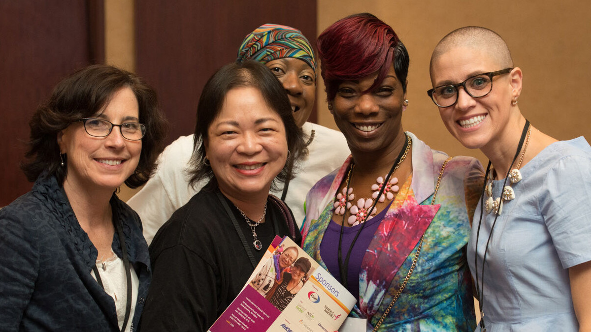 Catherine Ormerod poses for a photo with conference attendees