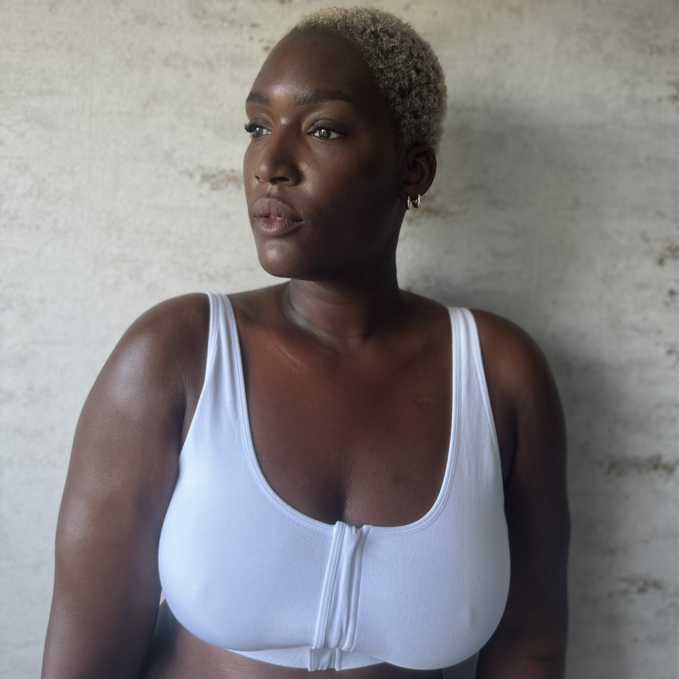 A woman wearing a white bra.