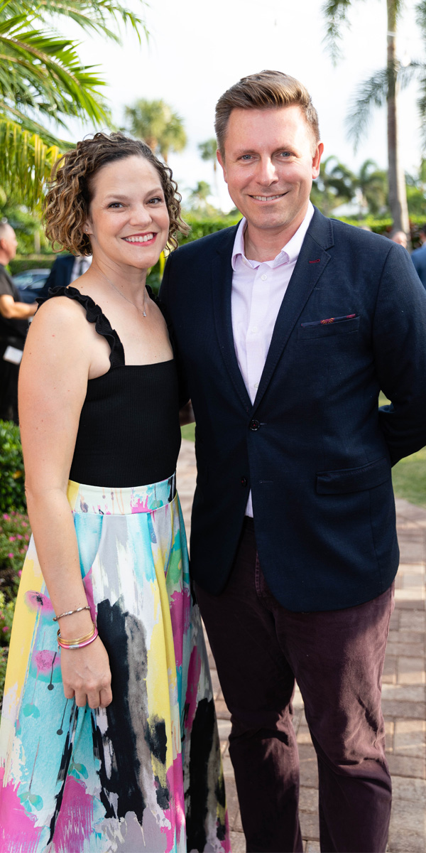 Rosemary, in a multicolored dress, with her husband