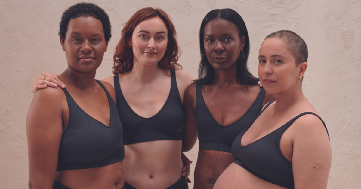 Four young women in black bras