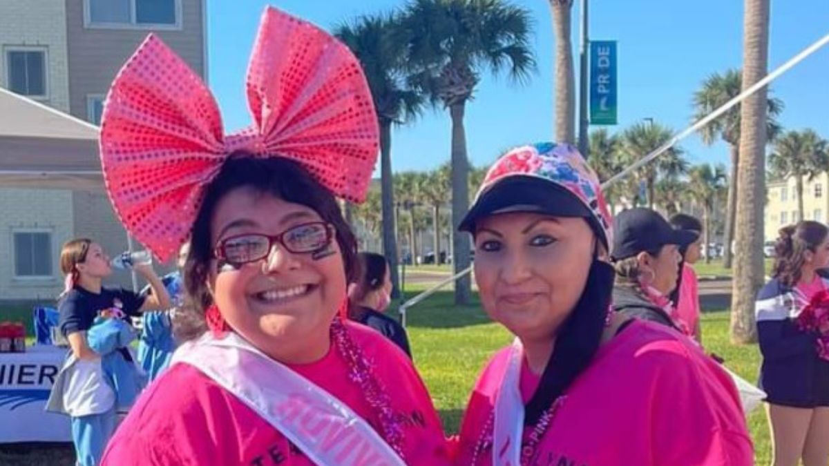 Ashlynn Gomez and her mother wear bright pink at an outdoor breast cancer event