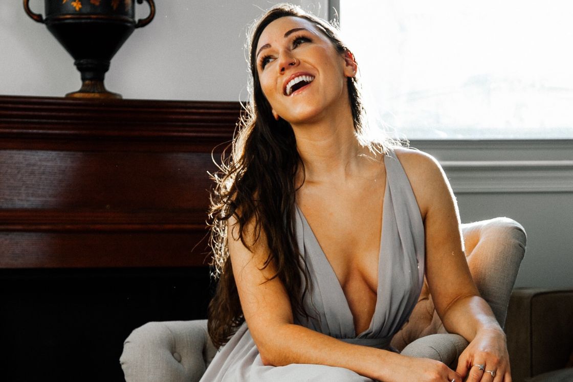 Jamie laughs in her wedding dress