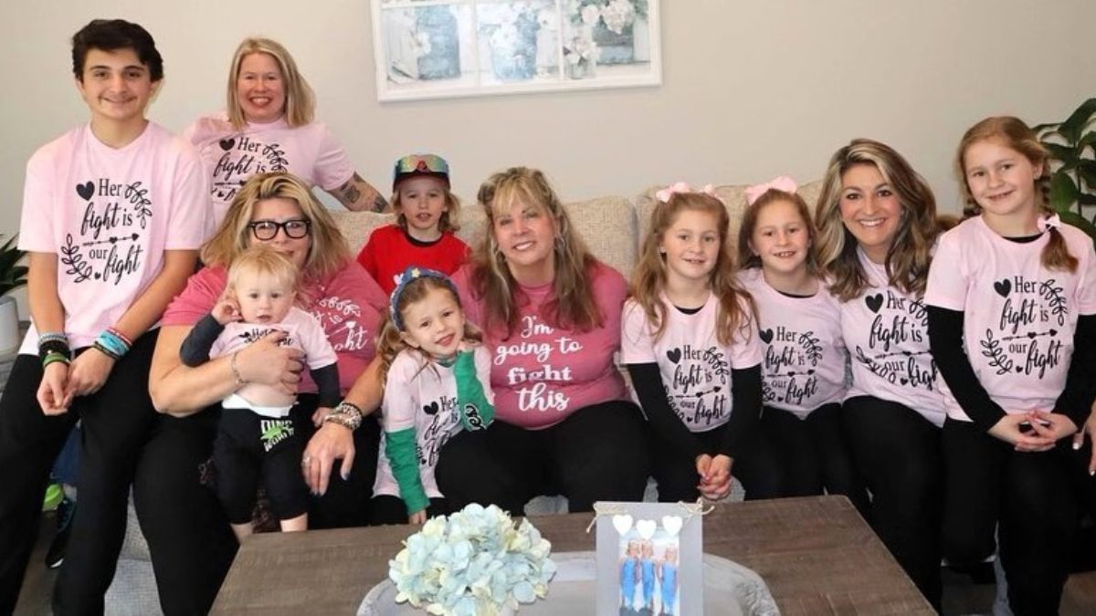 Carolyn Nickels with her nieces and nephews gathered on the sofa