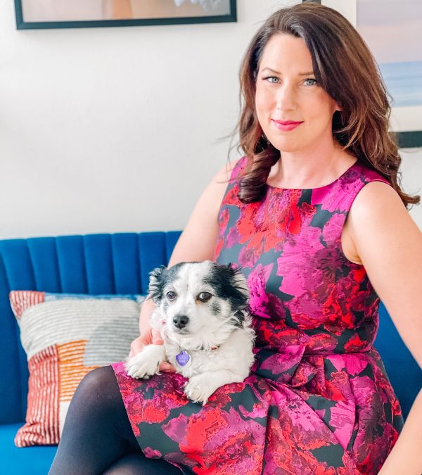 Megan O'Neill and her little dog pose for a picture