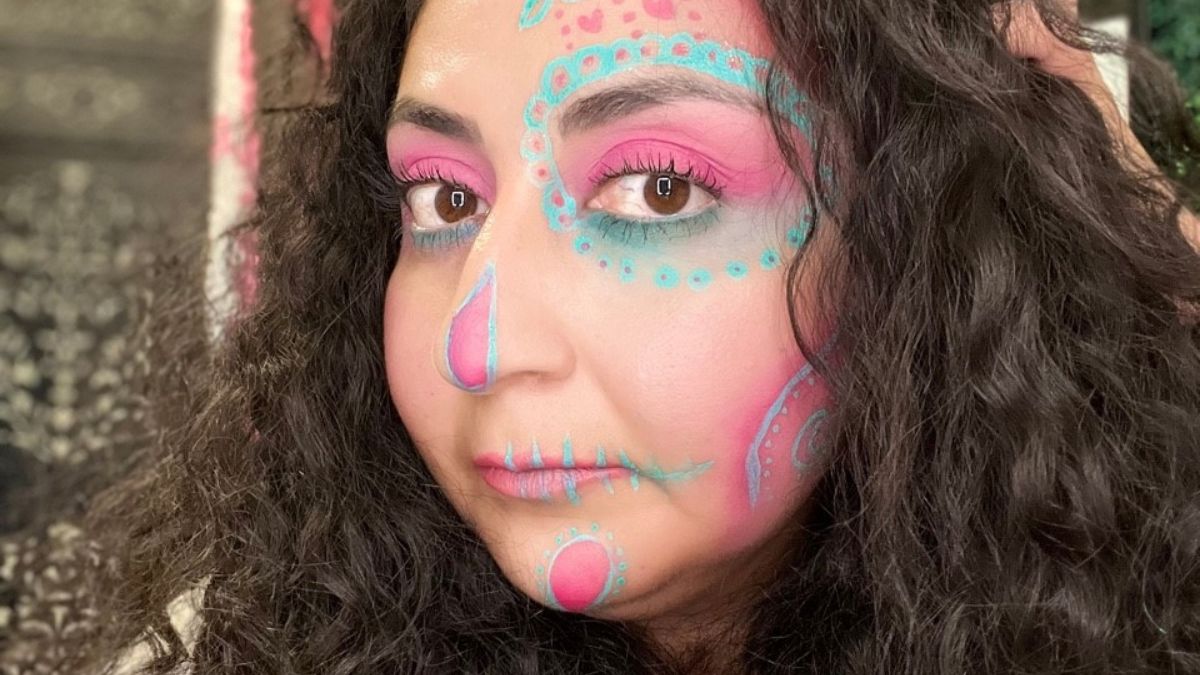 Adriana Huerta shows her face painted beautifully for the Dia de los Muertos