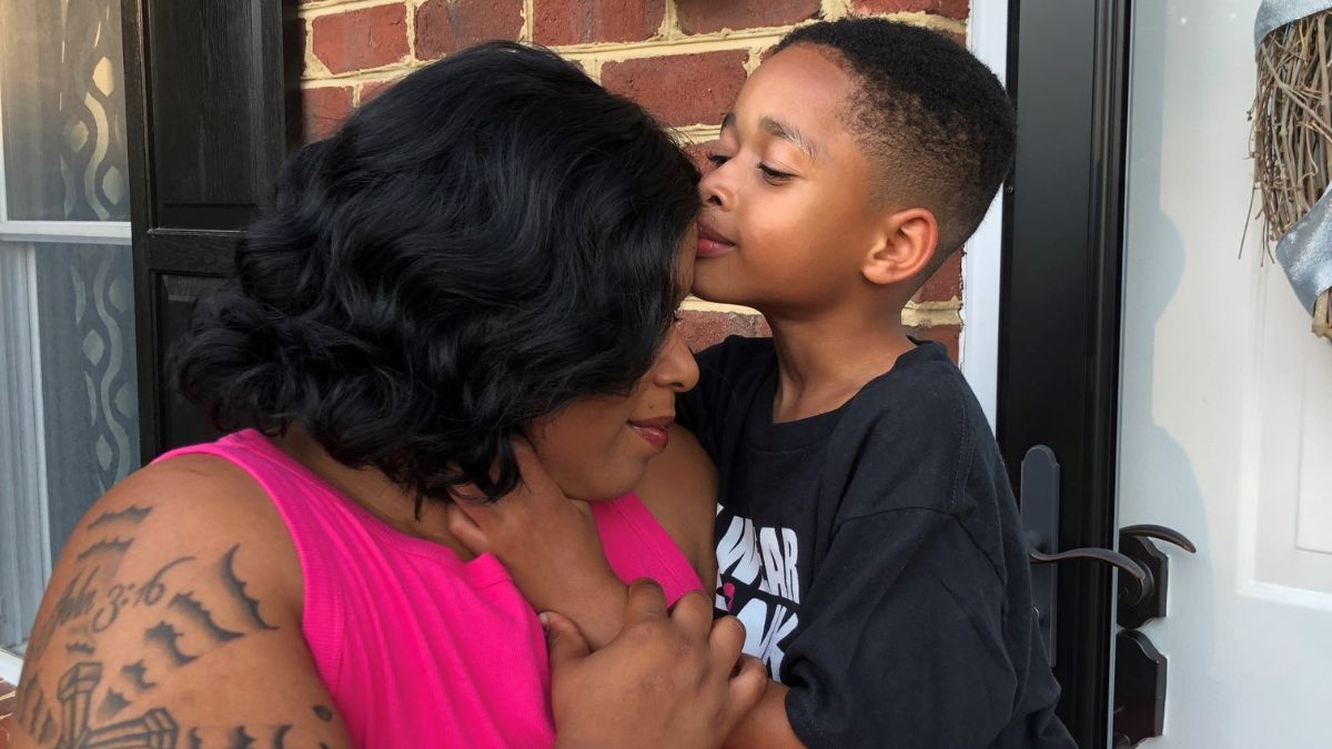 Stephanie Smith receives a tender kiss from her young son