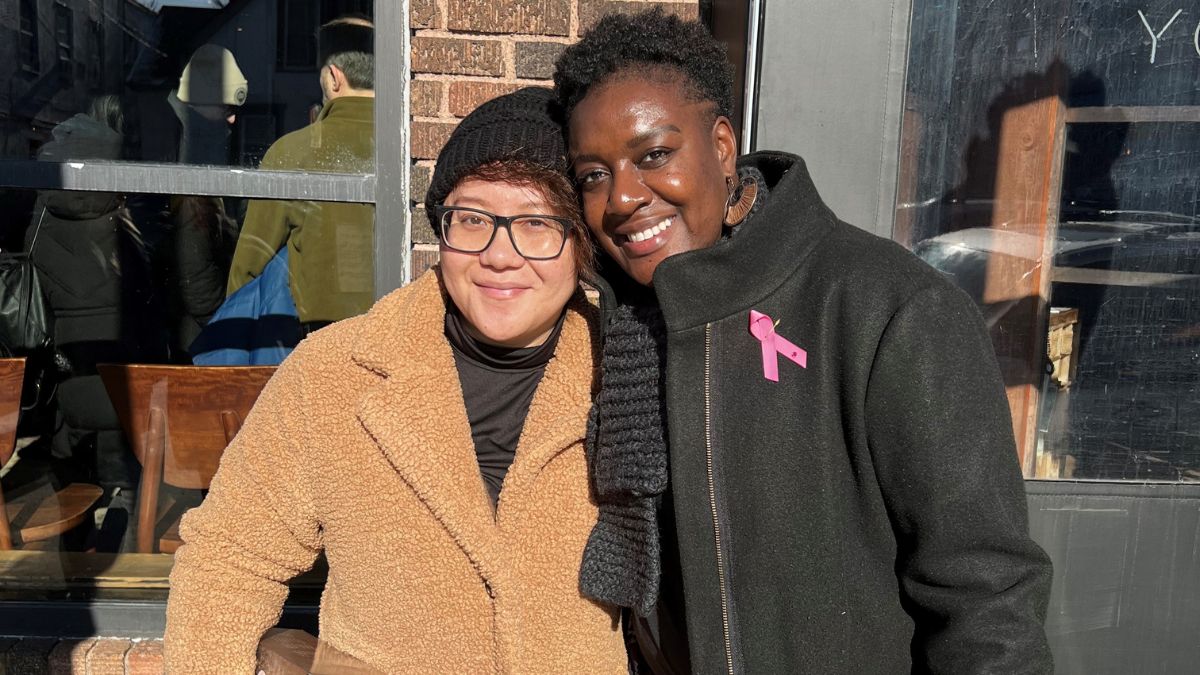 Victoria Seamon and her partner huddle together in winter's cold temp