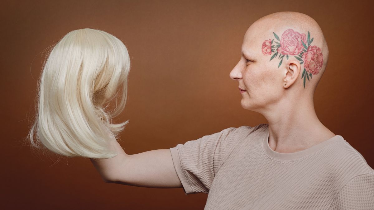 woman holding a wig