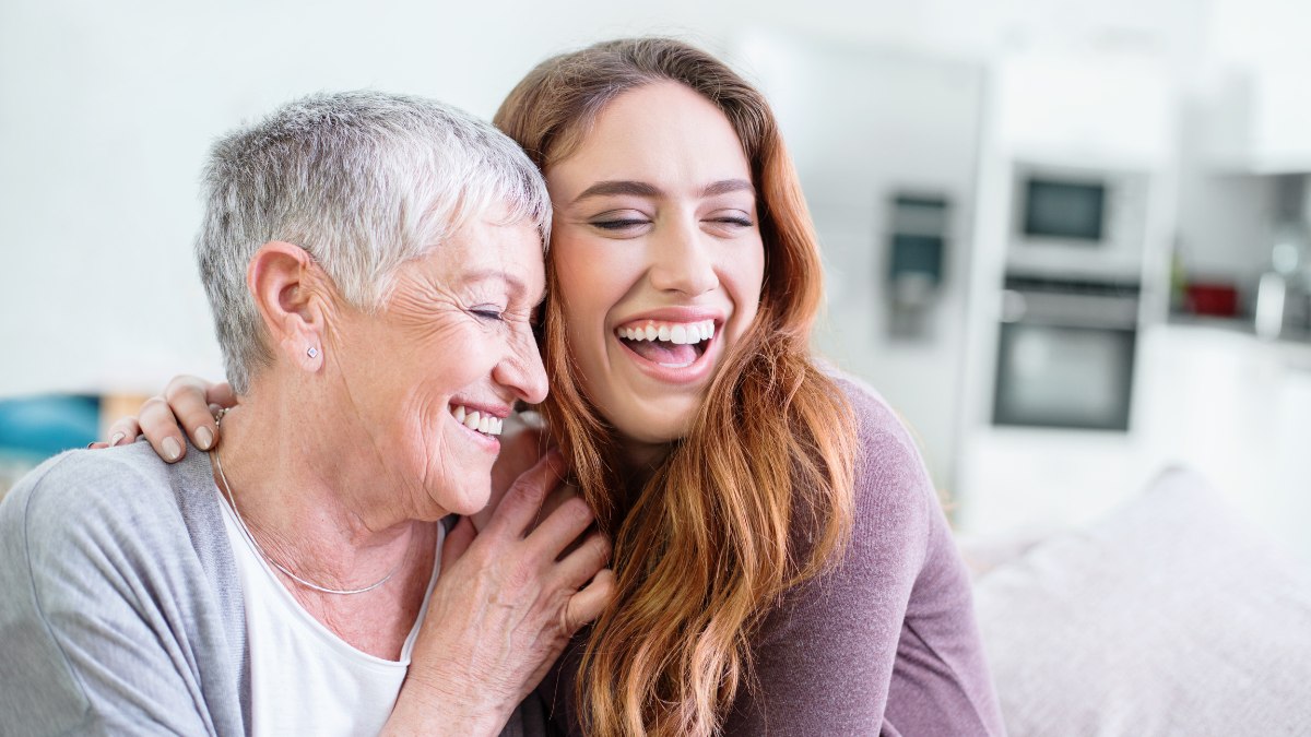Old and young woman hugging