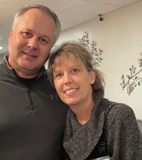 Tammy Uhl and her husband hold each other close