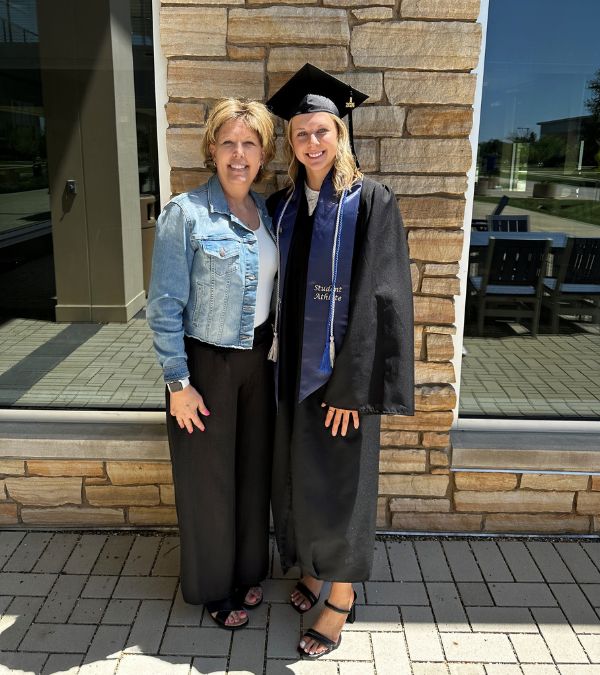 Tammy Uhl and her daughter in a graduation cap
