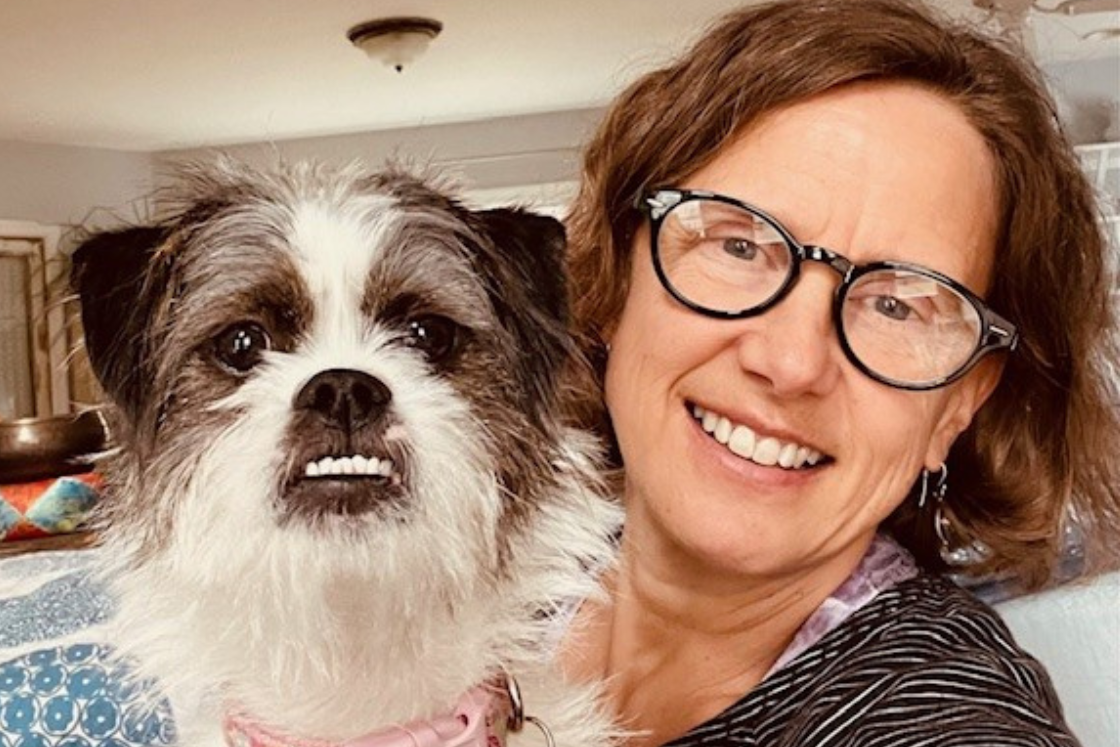 Laura-Lynn Renner holds her puppy CJ up proudly