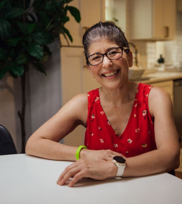Marianne Sarcich smiles as she waits for a meal