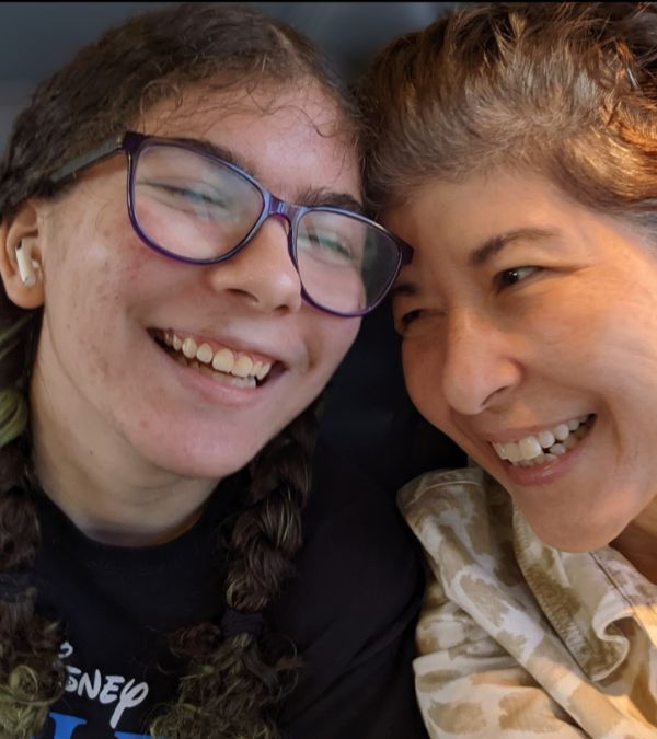 Marianne Sarcich nuzzles her daughter